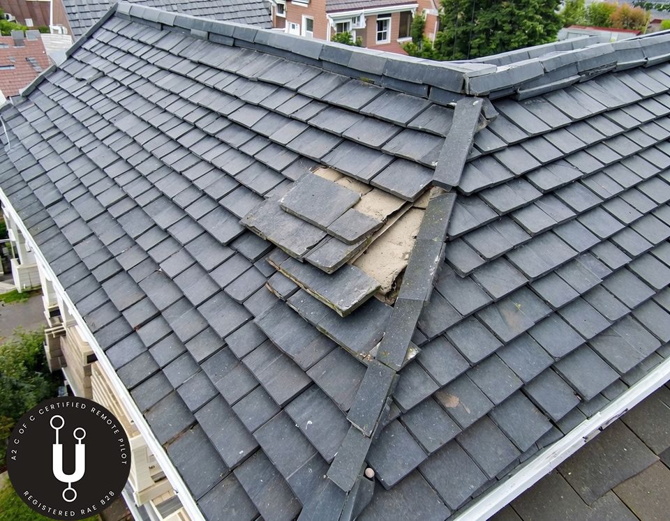 High-resolution drone roof inspection in Accrington showing chimney stack mortar and slate condition.